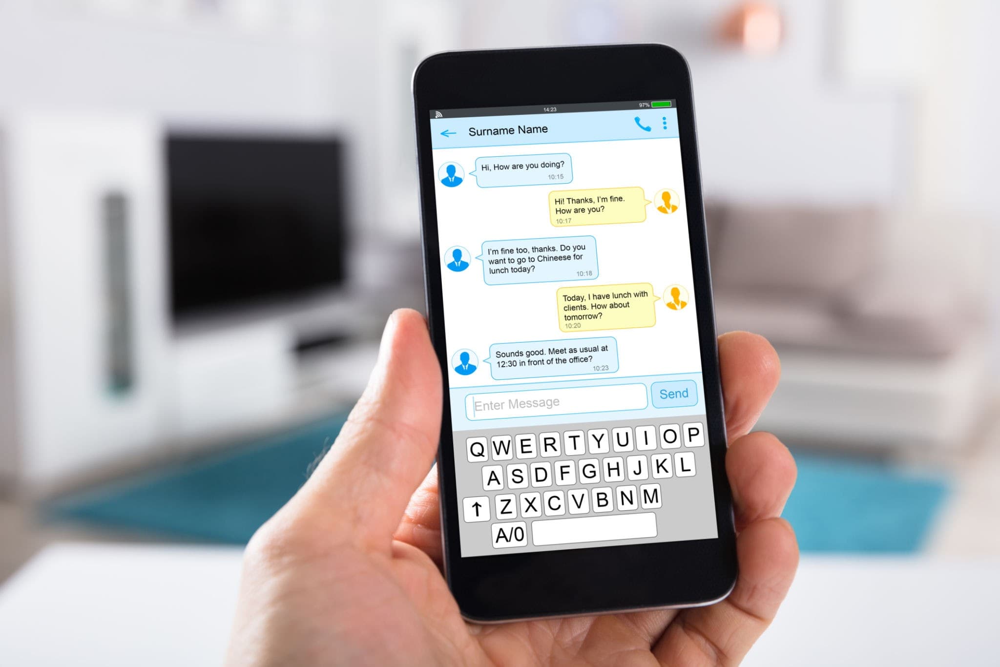 A close-up of a hand holding a smartphone, displaying a professional text message conversation.